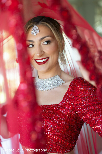 radiant bride,bridal veil,south asian beauty,wedding elegance,joyful moment,classic wedding portrait