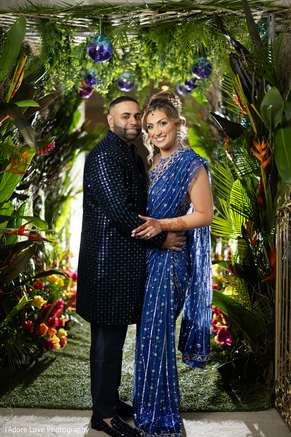 luxury wedding decor,tropical theme,lush florals,south asian elegance,regal couple,wedding backdrop