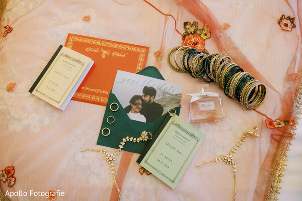 wedding flat lay,indian bridal details,invitation suite,bridal bangles,vow books,dupatta backdrop