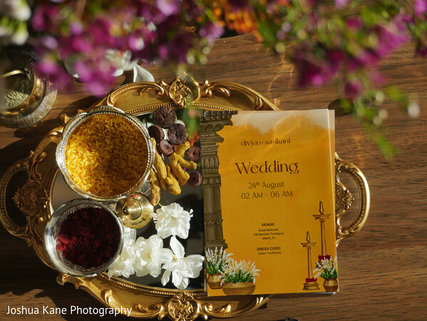 south indian wedding card,turmeric and kumkum decor,hindu wedding rituals,indian flat lay,marigold accents