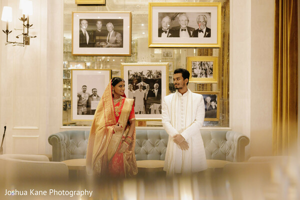 bride and groom,vintage backdrop,elegant setting,indian wedding fashion,wedding portrait