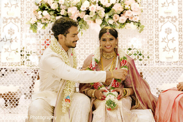 jaimala ceremony,indian wedding tradition,garland exchange,happy couple,wedding moment