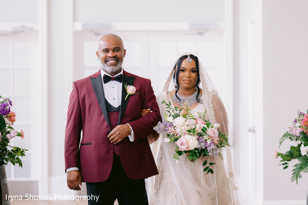 father and bride aisle walk,bridal bouquet,south asian bride,indoor wedding entrance