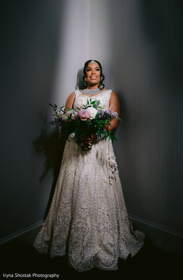 bride solo portrait,confident bridal pose,bouquet in hand,shadowed bridal photo,dramatic lighting