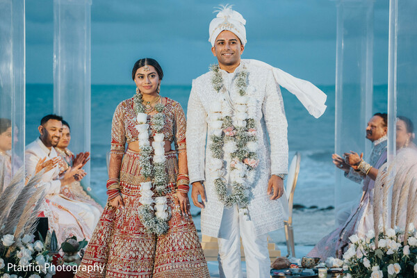 wedding exit,couple walking,fresh flower garlands,beach wedding aisle,post-vows