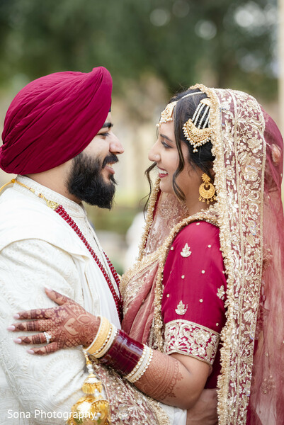 south asian bride,sikh groom,emotional wedding photo,bridal kalire,maroon bridal look