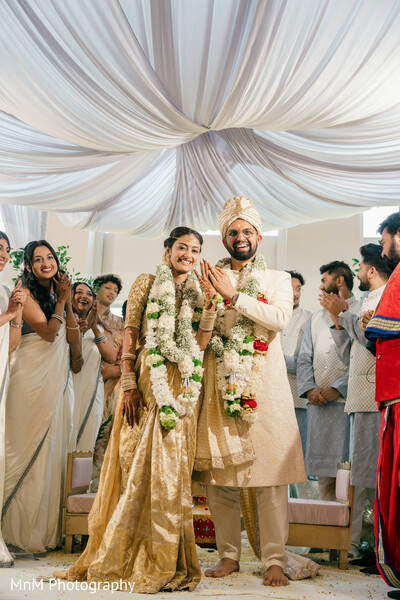 wedding celebration moment,south asian wedding cheers,group celebration,under mandap moment