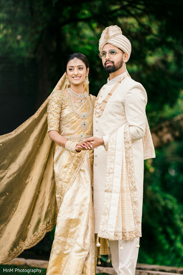 formal wedding portrait,bride and groom outdoors,traditional south asian outfits