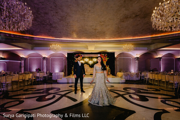 couple moment,indian wedding reception,hand in hand,reception glam,bridal gown