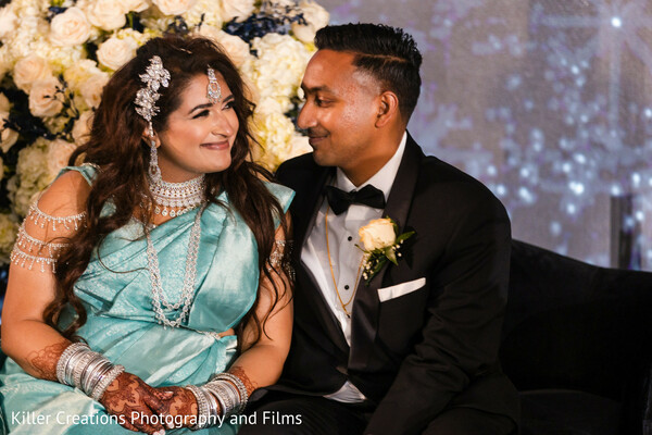 bride and groom,candid couple moment,indian wedding fashion,teal saree,henna bride,wedding lounge,intimate look,cultural elegance,newlyweds,romantic moment
