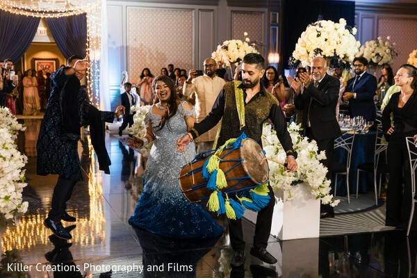 dance performance,wedding entertainment,colorful costumes,cultural wedding dance,energetic celebration,party crowd,indian wedding,traditional dance,festive moment,group performance