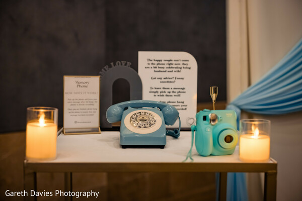 wedding ring flat lay,indian wedding still life,invitation perfume rings,styled detail shot,cultural wedding accessories,luxury wedding design,couple keepsakes image,tropical wedding blue theme,meaningful wedding elements,wedding branding photo