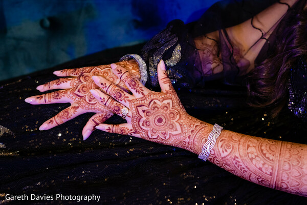 mehndi wedding closeup,henna bridal hands,bride hand detail shot,indian wedding jewelry,traditional bridal look,bridal accessories photo,wedding culture closeup,wedding henna art