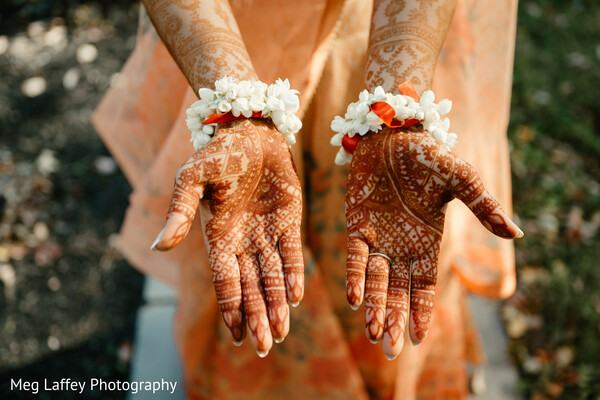 bridal henna,mehendi design,wedding hand close-up,traditional wedding art,floral henna design.