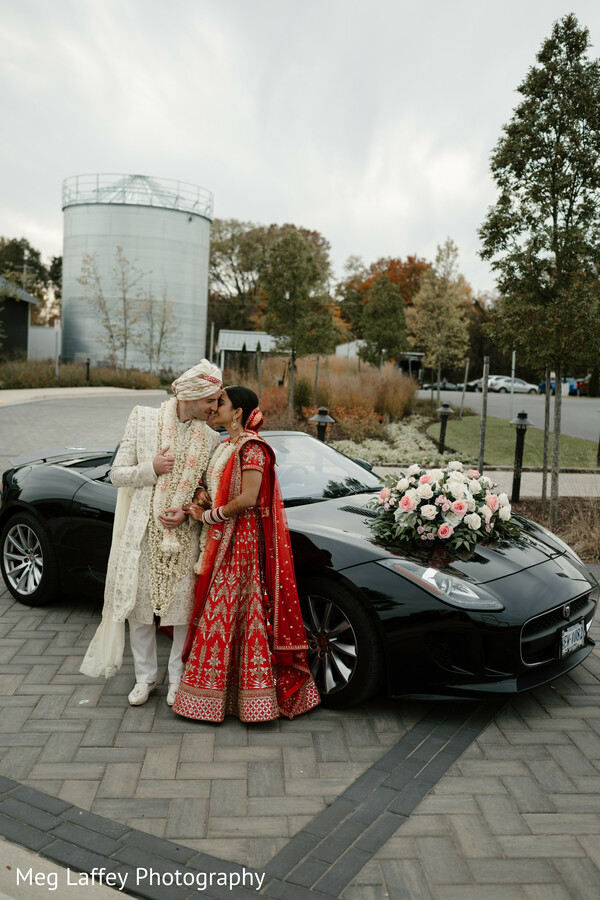 couple wedding car,luxury wedding arrival,floral decor car,stylish wedding photo,bride groom luxury moment.