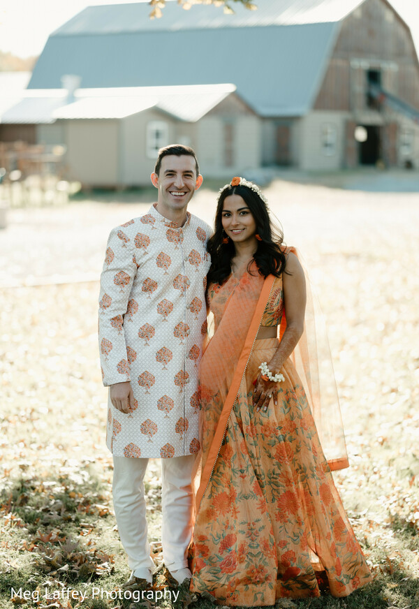 casual wedding portrait,couple matching outfits,orange lehenga,natural couple photo,outdoor love story.