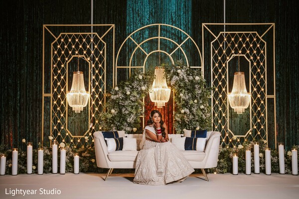 luxury wedding decor,geometric gold wedding stage,couple wedding portrait,candlelit ceremony,opulent wedding scene,lavish wedding backdrop,romantic golden glow,chic wedding styling.