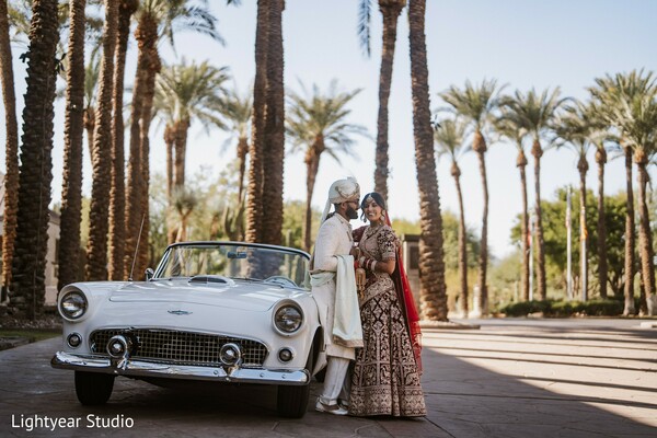 vintage wedding car,classic wedding portrait,bride and groom,elegant wedding photo,outdoor shoot.