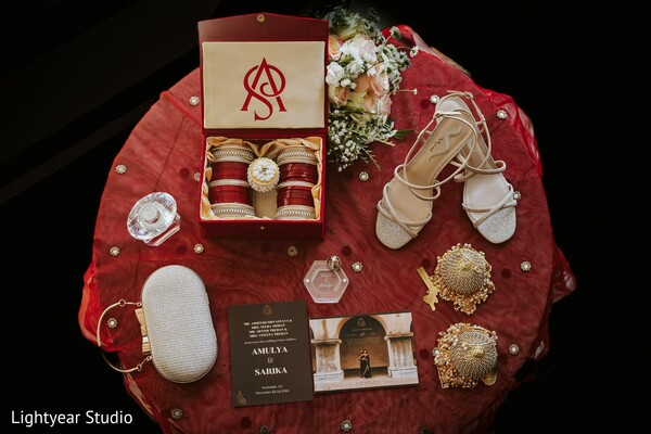 wedding rituals,symbolic items,wedding table decor,detailed wedding photography,cultural wedding elements.
