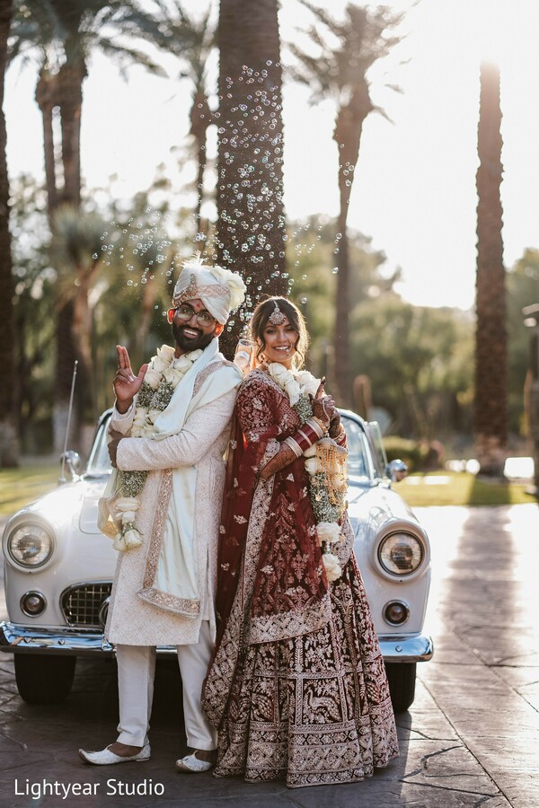 wedding car,vintage vehicle,couple pose,elegant wedding,classic wedding style.
