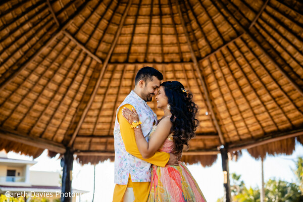 beach wedding,destination couple,tropical embrace,seaside romance,palm leaf shelter