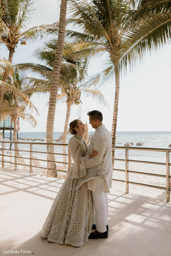 palm trees,oceanfront shoot,couple elegance,sherwani and gown,romantic view