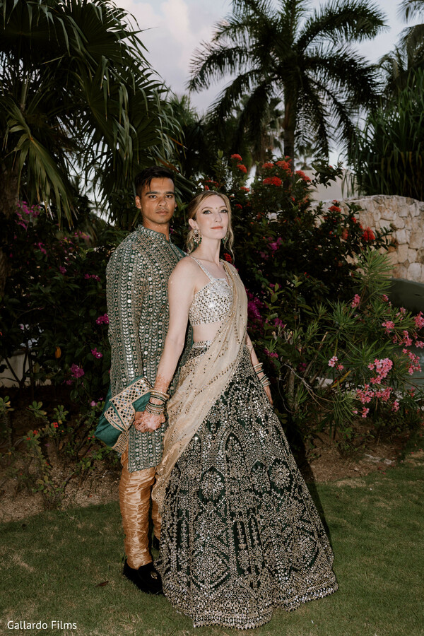 lush greenery,close couple pose,elegant wedding shoot,romantic gaze,destination wedding
