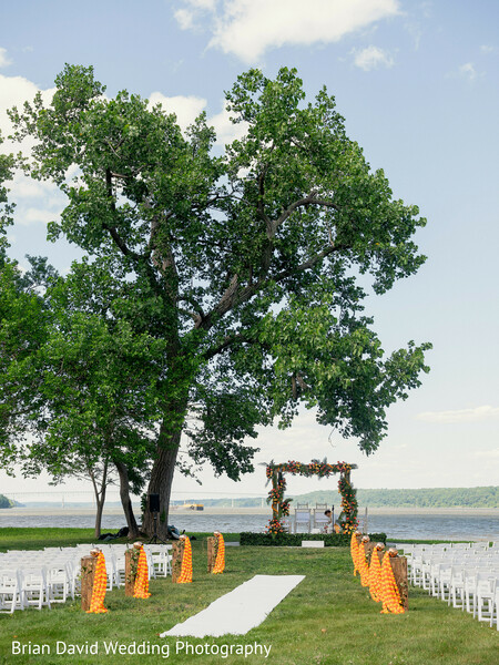 outdoor wedding,lakeside venue,peaceful ceremony,mandap setup,minimalist elegance,nature wedding