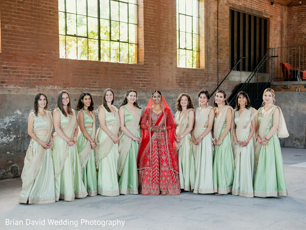bridal party,bridesmaids in mint,group portrait,red lehenga,color contrast,stylish wedding party