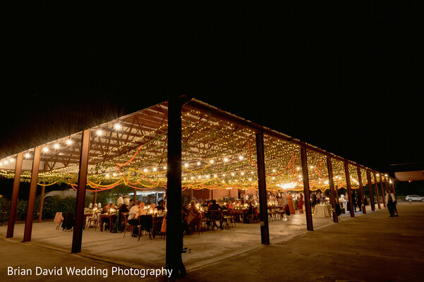 wedding night decor,open-air venue,pavilion lighting,night reception,symmetrical design,luxury celebration