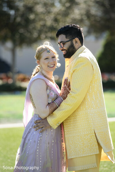 couple portrait,golden hour,fusion wedding,affectionate moment,soft lighting,bride and groom