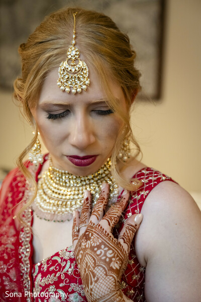 bridal close-up,jewelry,red lehenga,bride solo,emotional moment,getting ready
