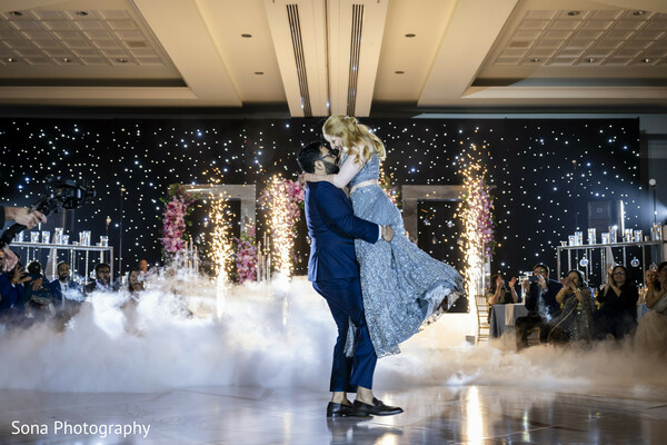 first dance,indoor fireworks,wedding reception,couple dancing,spark fountains,ballroom