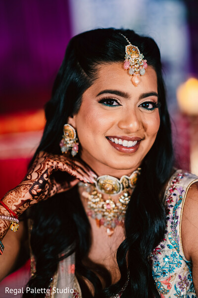 fashion-focused bridal pose,bridal confidence moment,regal bride style,indoor bridal photo,getting ready portrait