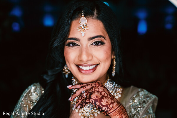 happy bride photo,close-up bridal henna,south asian wedding glam,bright bride smile,joyful wedding moment,bridal expression photo,indian wedding look,glitter bridal pose,cheerful bride image,mehndi close-up