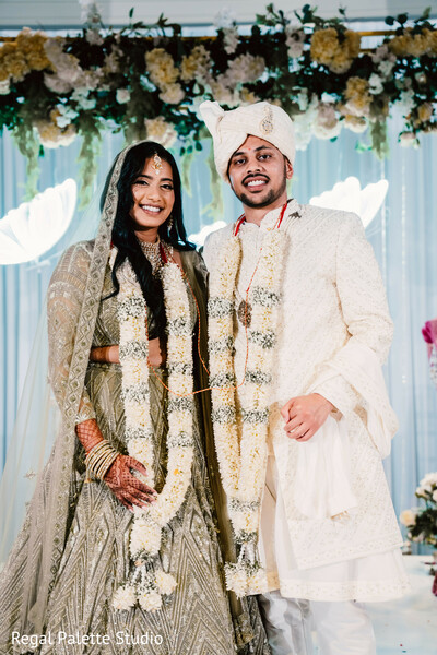 indian wedding,bride photo,floral garlands brides,wedding joy moment,south asian bridal fashion,bride smiling together,vibrant wedding portrait,floral wedding ceremony,love