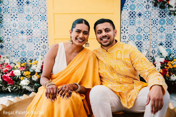 haldi ceremony couple,yellow indian prewedding,joyful haldi moment,wedding ritual photo,couple laughing haldi,south asian tradition,turmeric wedding ceremony,pre-wedding festivities,vibrant indian wedding,fun couple photo
