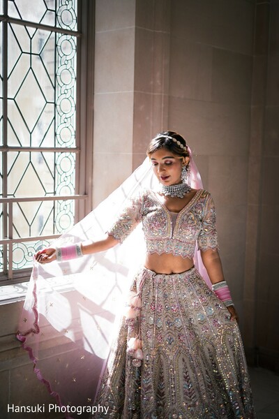 bridal twirl pose,dupatta flowing motion,bride in action,fierce bridal portrait,south asian fashion twirl,pink lehenga movement,bridal power pose,indian bride elegance,soft light fashion photo,bridal motion capture