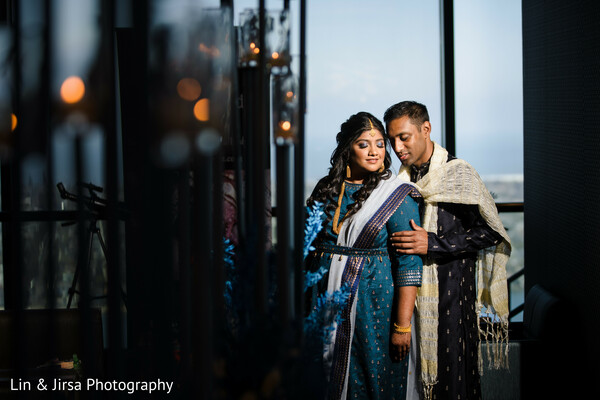 pre-wedding portrait,royal blue outfit,indian couple pose,regal couple photo,entryway wedding image,elegant traditional wear,cultural wedding fashion,gold embroidery outfits,south asian elegance,luxury couple moment