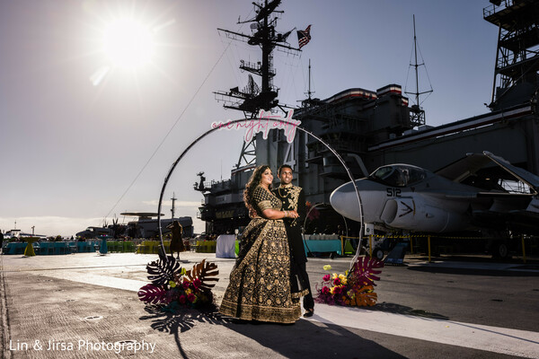 vintage plane wedding,bridal aircraft pose,black lehenga shoot,destination bride,historical location shoot,stylish indian bride,runway wedding theme,dramatic bridal fashion,military aircraft wedding,unique wedding location