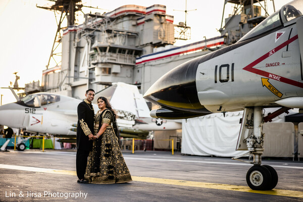 military aircraft wedding,indian bride bold look,fighter jet photo,runway wedding theme,bridal confidence,aviation wedding shoot,modern south asian bride,unique wedding setting,dramatic wedding style,bridal power pose