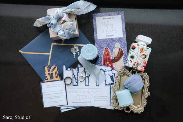 wedding stationery flat lay,blue and gold invitations,wedding welcome kit,bridal details photography,personalized wedding favors,luxury wedding stationery,creative wedding design,invitation suite details,modern wedding flat lay,elegant gift presentation.