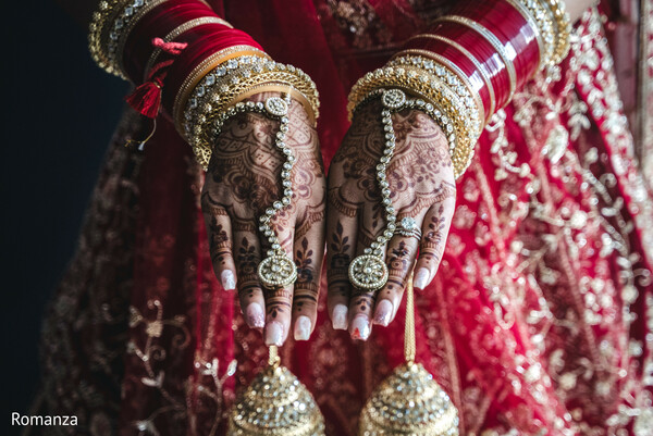 bridal lehenga details,mehndi close-up,kaliras,wedding jewelry,hands and henna,traditional bridal look,indian bride,red and gold embroidery