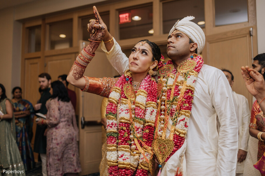 just married,garland ceremony,joyful couple,indian wedding,wedding glow,marriage celebration,sweet moment,traditional outfits,bride and groom,cultural wedding