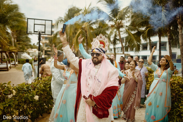 baraat celebration,indian groom,smoke bombs,baraat entrance,festive energy,wedding party,joyful moment,groom arrival,indian tradition,cultural celebration