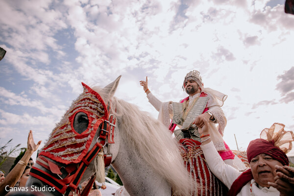 baraat arrival,groom on horse,desi wedding tradition,vibrant celebration,baraat energy,outdoor indian wedding,sky background,turban groom,horse wedding entry,wedding parade