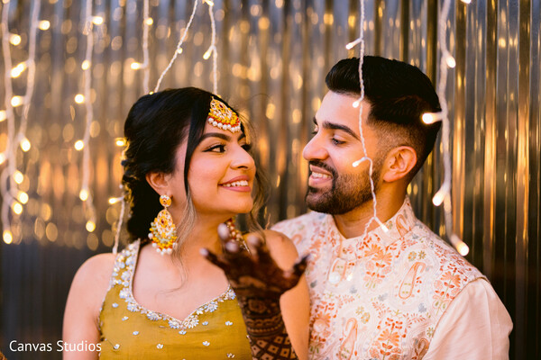 haldi celebration,prewedding moment,yellow outfit,string lights decor,desi bride joy,candid love,indian wedding ritual,couple chemistry,festive sparkle,fun wedding moment