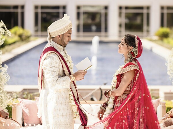 wedding vows,south asian couple,bride and groom,emotional ceremony,wedding fountain,outdoor rituals,sacred promises,destination wedding vows,romantic exchange,cultural union