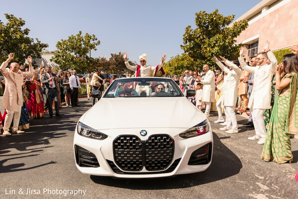 indian baraat,groom entrance,bmw wedding car,baraat celebration,dancing family,wedding traditions,luxury wedding ride,festive arrival,groom procession,modern baraat