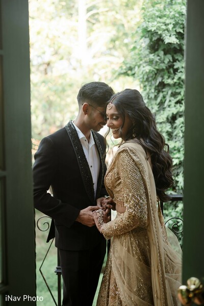 couple portrait,romantic embrace,intimate wedding photo,window light photography,bride and groom moment,wedding love story,elegant couple pose,south asian couple,soft romantic photo,timeless wedding image